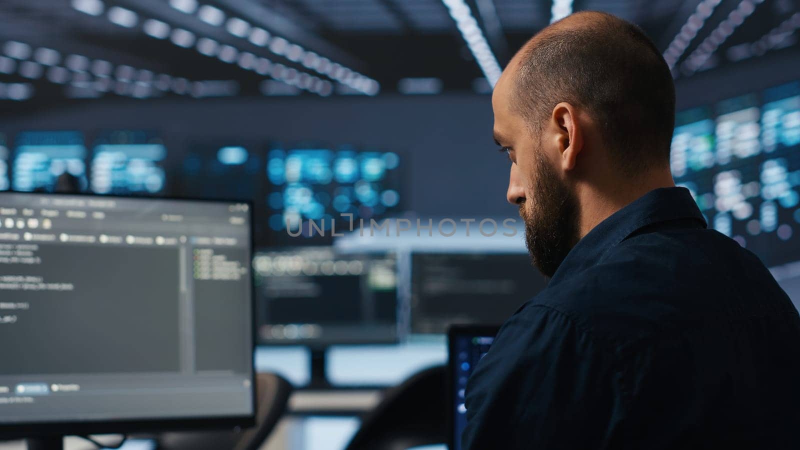 IT supervisor overseeing server room, running code on PC, troubleshooting rigs. Software admin upgrading hardware clusters, networking systems and storage arrays, close up shot