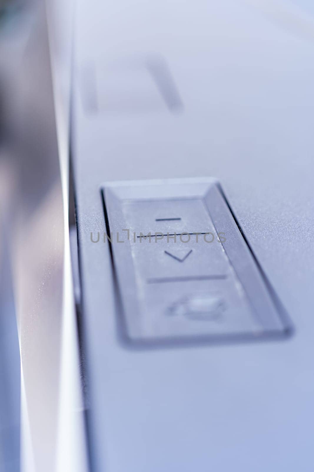 Denver, Colorado, USA-May 5, 2024-This image captures a close-up view of the control buttons used for operating the tailgate and tonneau cover of a Tesla Cybertruck, highlighting the futuristic and functional design elements.