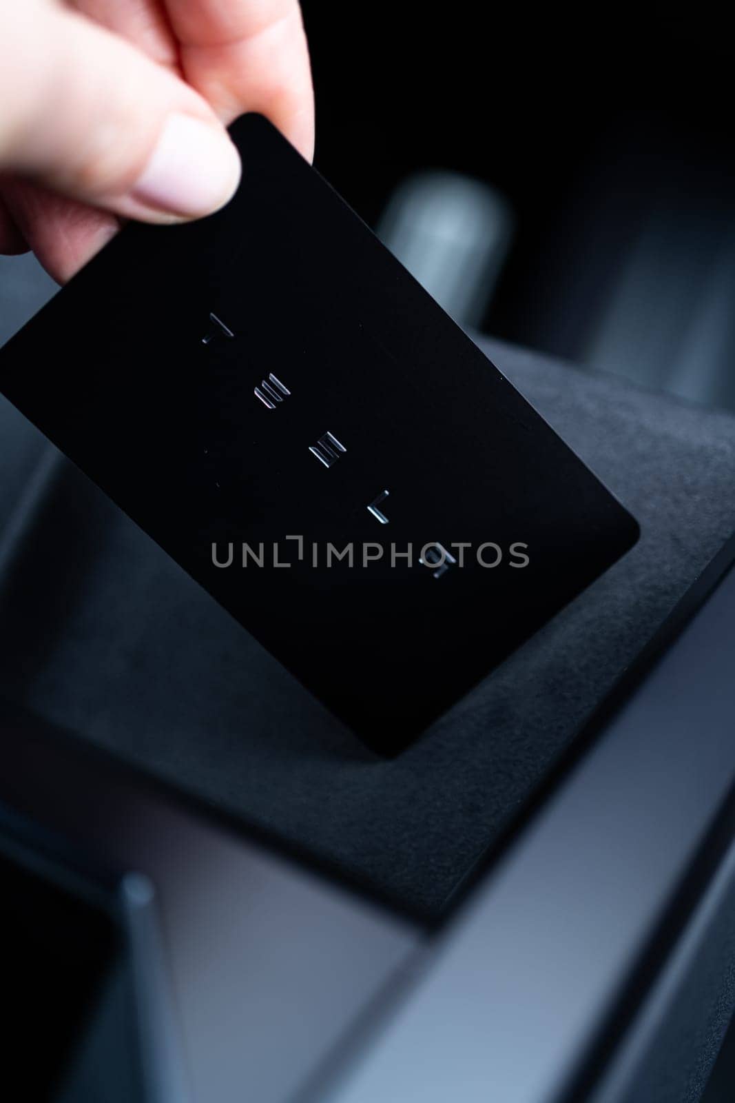 Denver, Colorado, USA-May 5, 2024-his image captures the sleek Tesla Cybertruck key card positioned neatly in the vehicle card holder, highlighting its minimalist design and emphasizing the modern aesthetic of Tesla innovative features.