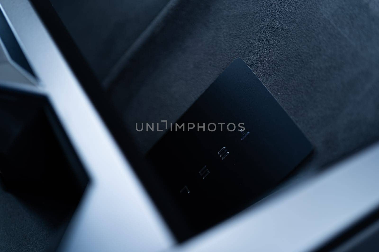 Denver, Colorado, USA-May 5, 2024-his image captures the sleek Tesla Cybertruck key card positioned neatly in the vehicle card holder, highlighting its minimalist design and emphasizing the modern aesthetic of Tesla innovative features.