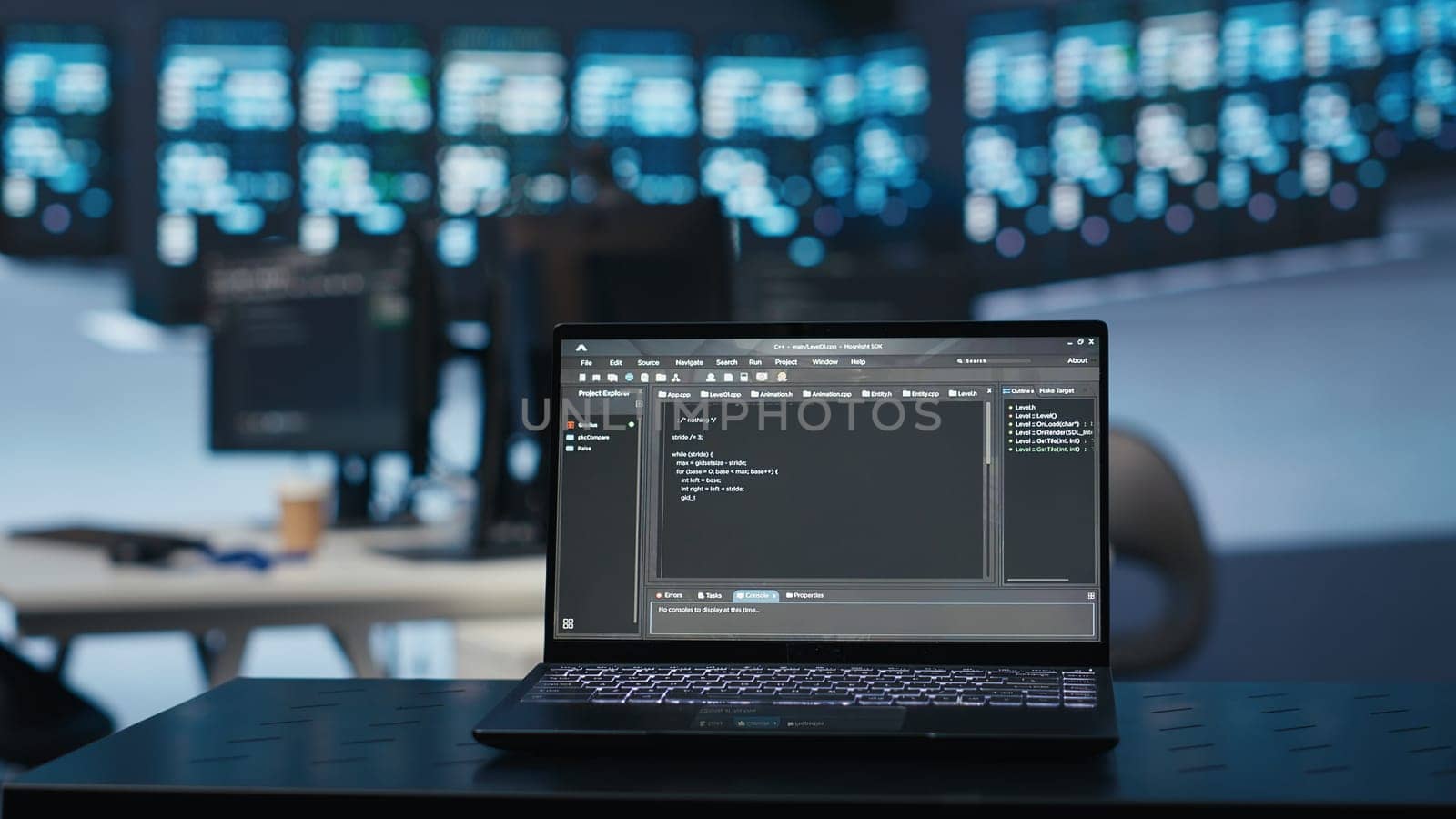 Focus on script running on laptop in server room, close up shot by DCStudio