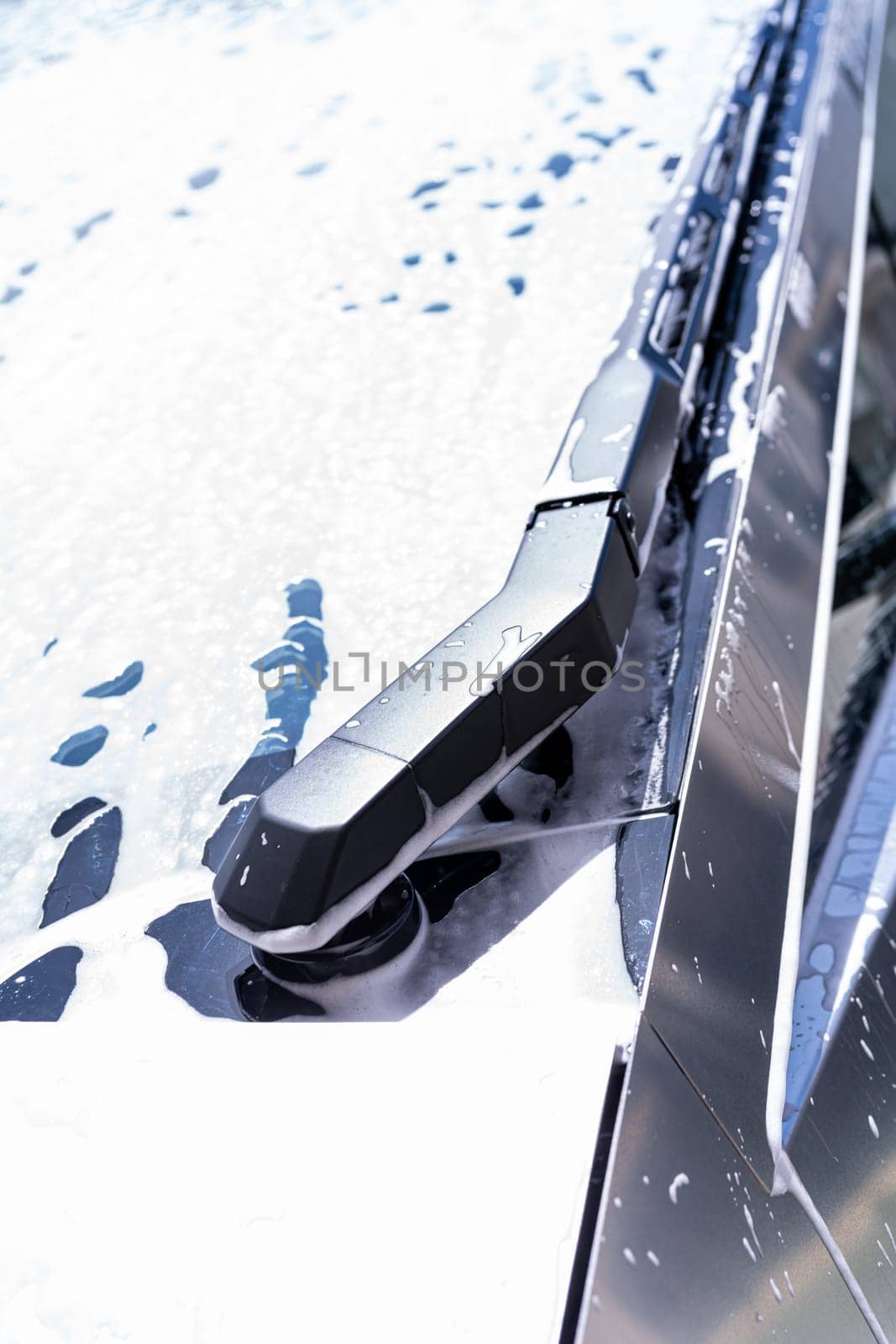 Detailed View of Tesla Cybertruck Windshield Wiper During Car Wash by arinahabich
