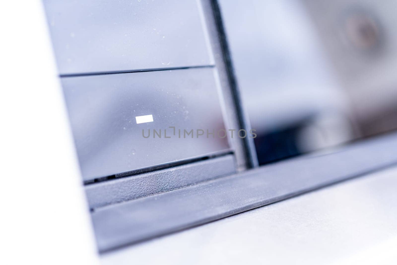 Close-up View of a Sleek Car Dashboard with a Visible Charging Icon by arinahabich