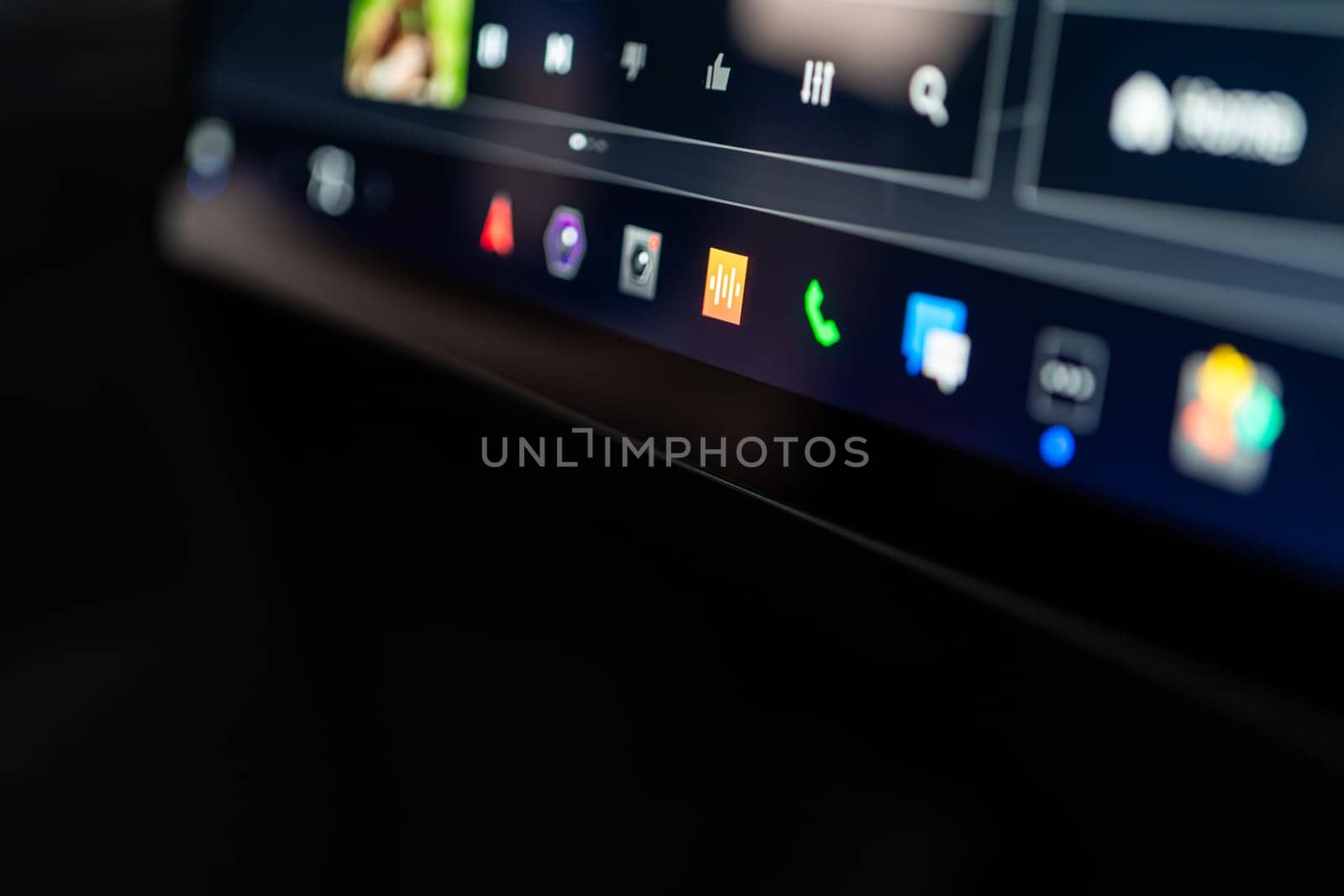 Denver, Colorado, USA-May 5, 2024-This image showcases a close-up view of the Tesla Cybertruck interactive touchscreen display, featuring vibrant icons for various vehicle controls. The focused lighting and high-resolution capture emphasize the sleek design and advanced technology integrated into the vehicle system.