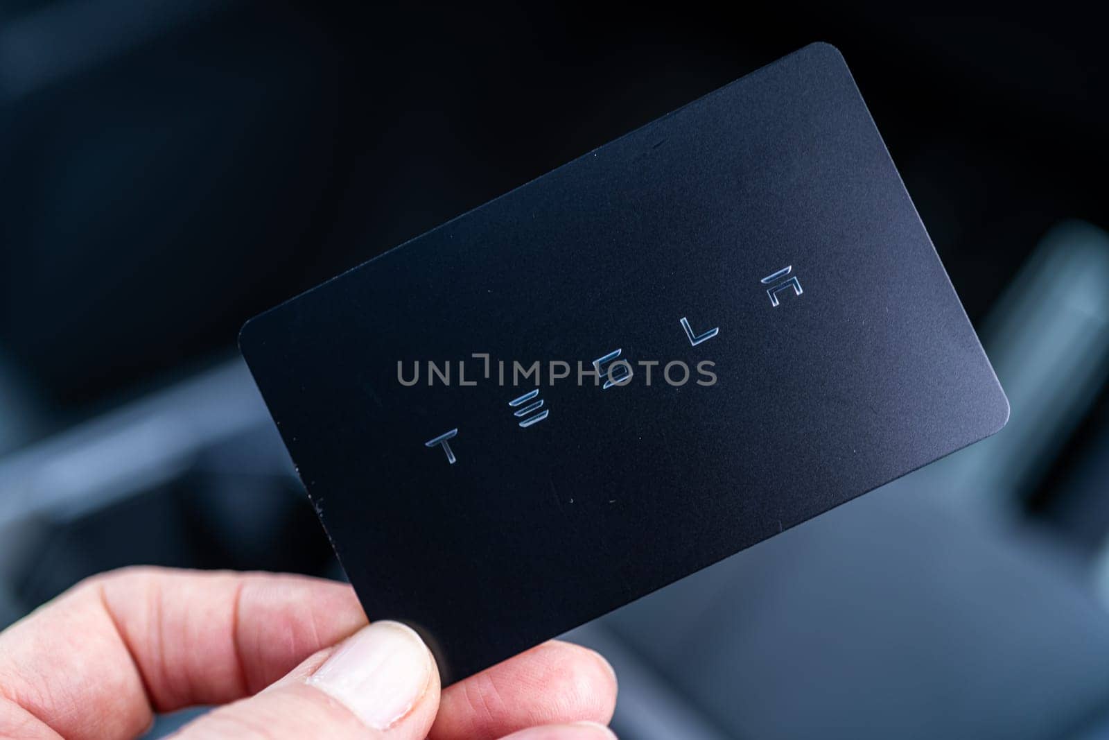 Denver, Colorado, USA-May 5, 2024-his image captures the sleek Tesla Cybertruck key card positioned neatly in the vehicle card holder, highlighting its minimalist design and emphasizing the modern aesthetic of Tesla innovative features.