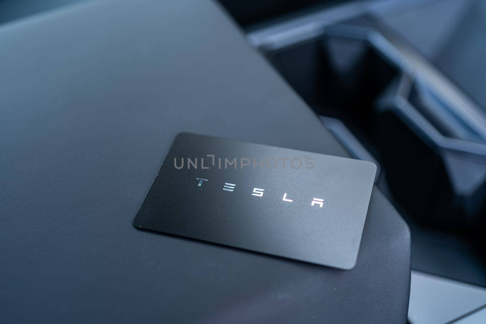 Denver, Colorado, USA-May 5, 2024-his image captures the sleek Tesla Cybertruck key card positioned neatly in the vehicle card holder, highlighting its minimalist design and emphasizing the modern aesthetic of Tesla innovative features.