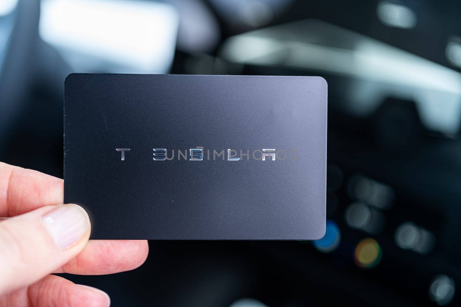 Denver, Colorado, USA-May 5, 2024-his image captures the sleek Tesla Cybertruck key card positioned neatly in the vehicle card holder, highlighting its minimalist design and emphasizing the modern aesthetic of Tesla innovative features.