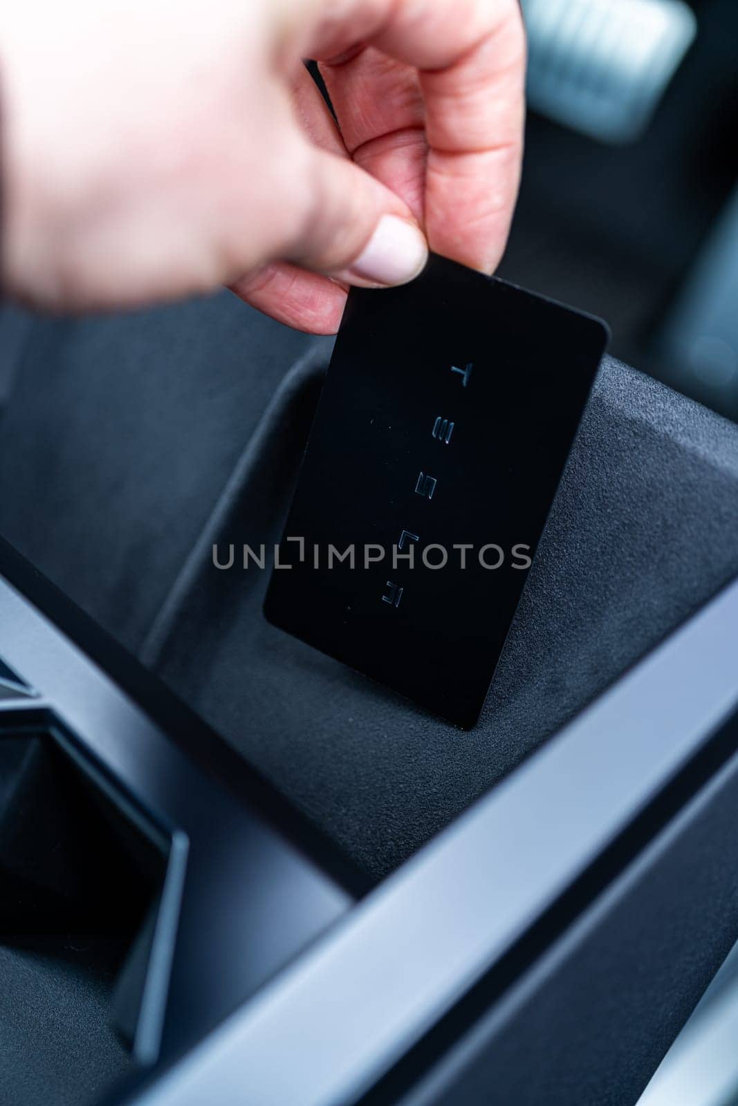 Close-Up of Tesla Cybertruck Key Card in Holder by arinahabich