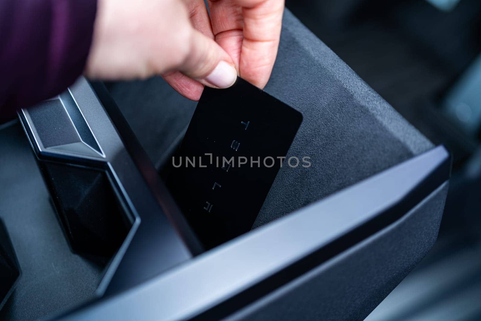 Denver, Colorado, USA-May 5, 2024-his image captures the sleek Tesla Cybertruck key card positioned neatly in the vehicle card holder, highlighting its minimalist design and emphasizing the modern aesthetic of Tesla innovative features.