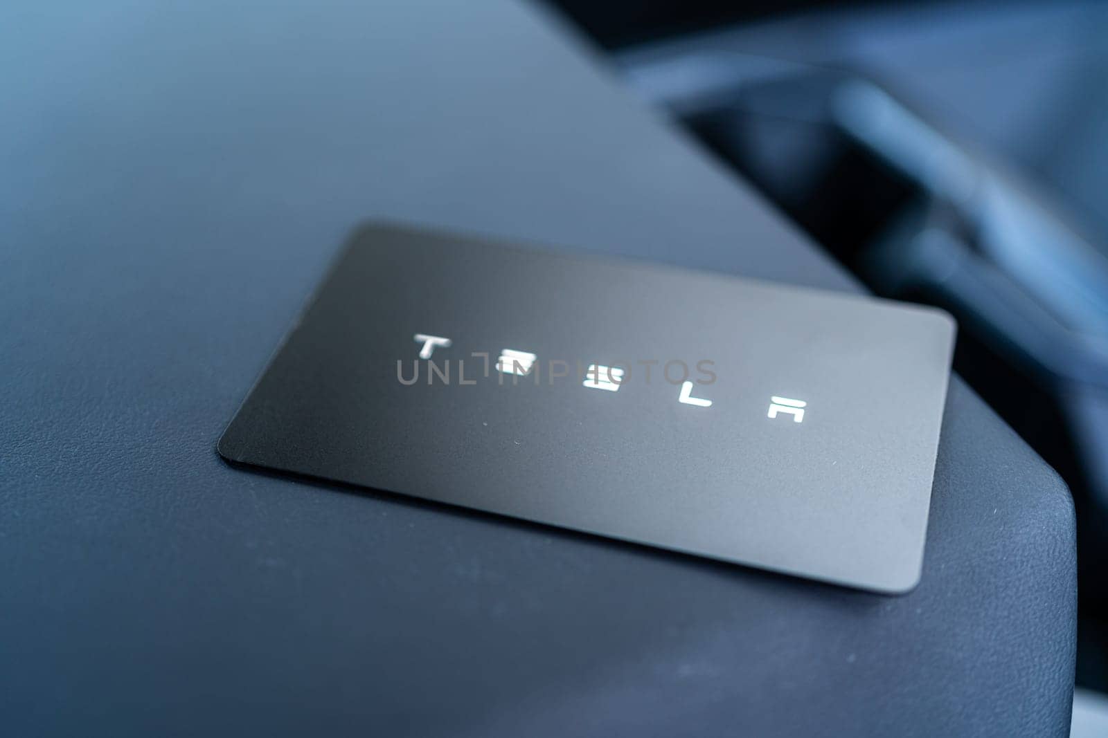 Denver, Colorado, USA-May 5, 2024-his image captures the sleek Tesla Cybertruck key card positioned neatly in the vehicle card holder, highlighting its minimalist design and emphasizing the modern aesthetic of Tesla innovative features.