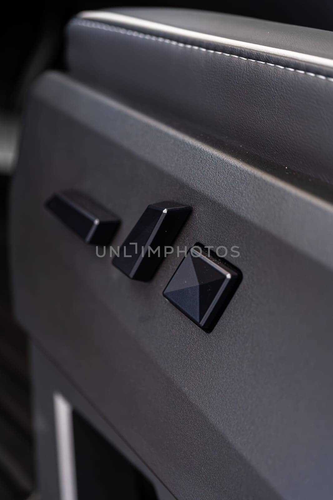 Close-up View of Seat Adjustment Buttons in Tesla Cybertruck by arinahabich