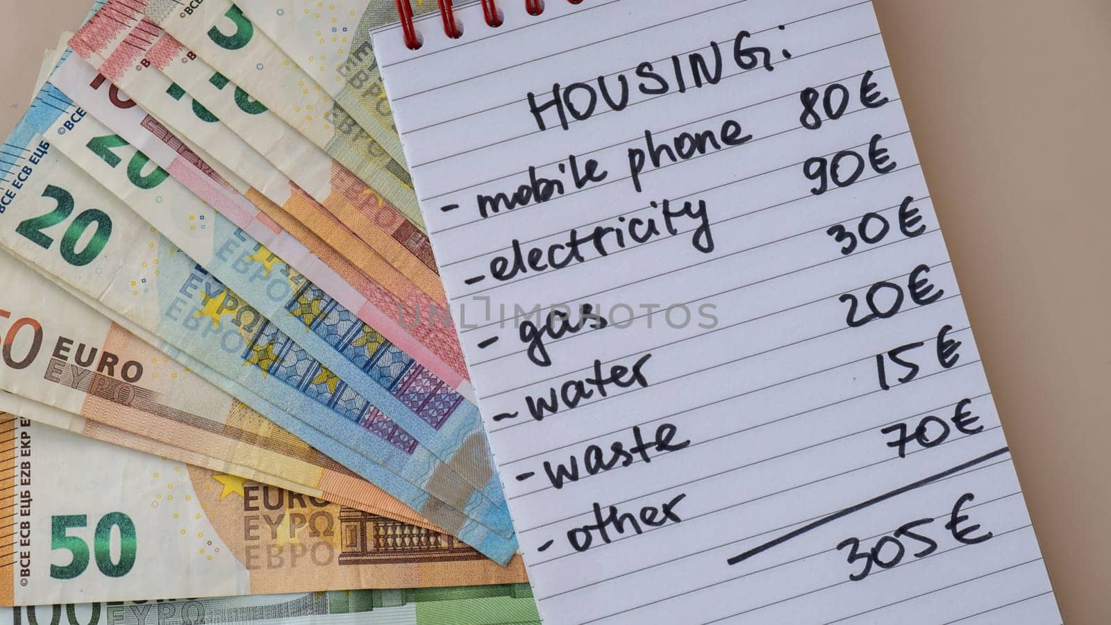 Counting expenses bills on housing electricity, gas, water. Banknotes of euro cash around. High prices for energy inflation crisis. Cut back on spending by anna_stasiia