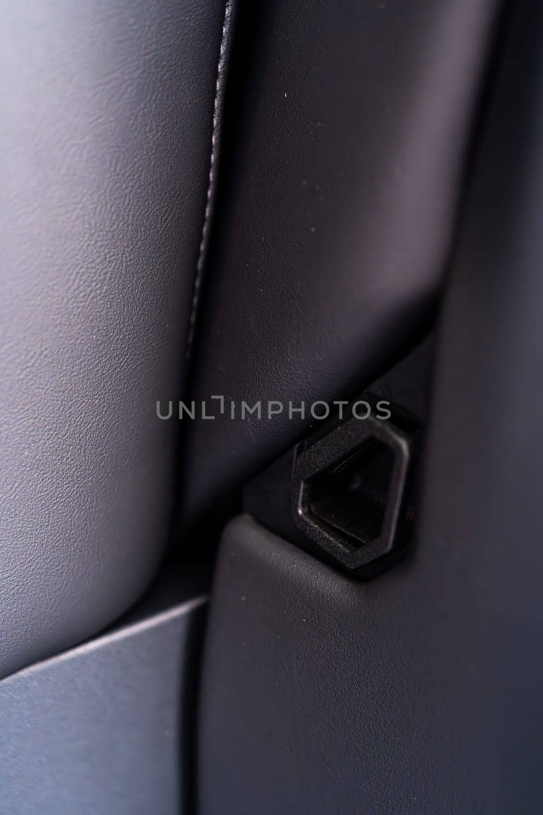 Denver, Colorado, USA-May 5, 2024-This image shows a detailed view of the back seat release pull strap in a Tesla Cybertruck, emphasizing the subtle yet functional design integrated within the vehicle interior.