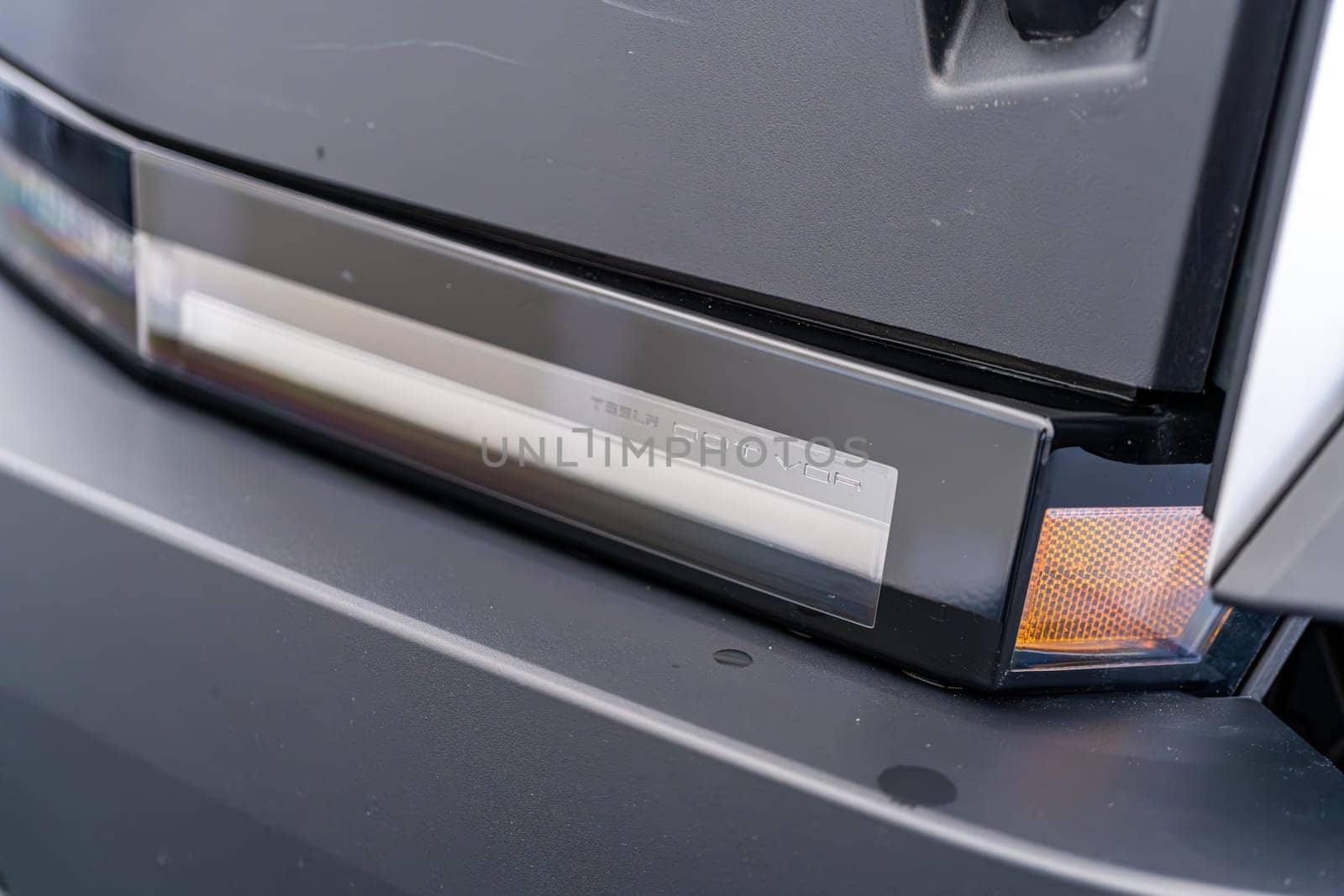 Denver, Colorado, USA-May 5, 2024-This image features a detailed view of the Tesla Cybertruck front light bar, highlighting the sleek design and advanced lighting technology. The chrome finish adds a modern touch, reflecting Tesla commitment to futuristic and functional vehicle design.