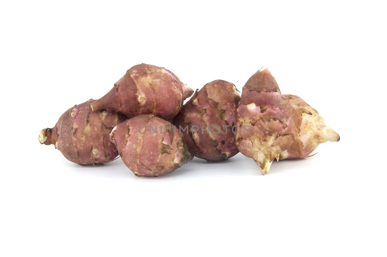 Jerusalem artichokes (sunchokes) tubers isolated on white by NetPix