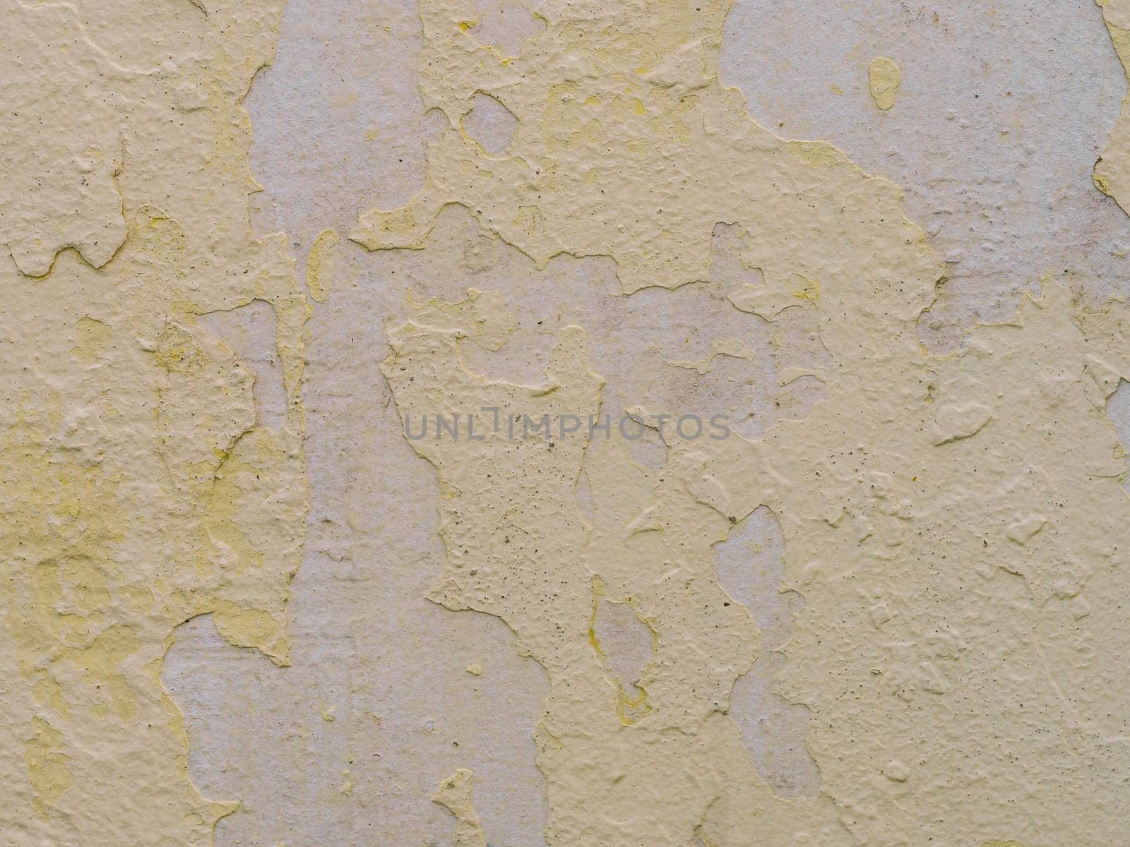 old concrete wall with cracks and peeling paint. Vintage style texture