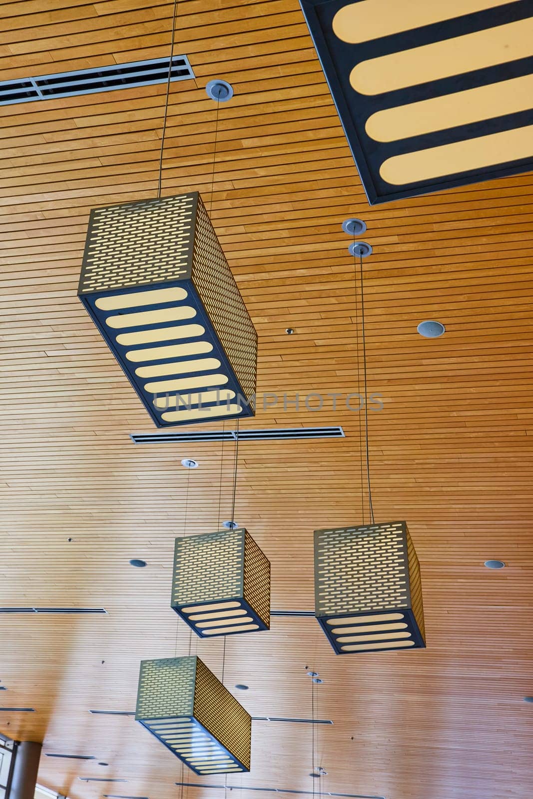 Modern interior with geometric light fixtures in Grand Wayne Convention Center, Fort Wayne.