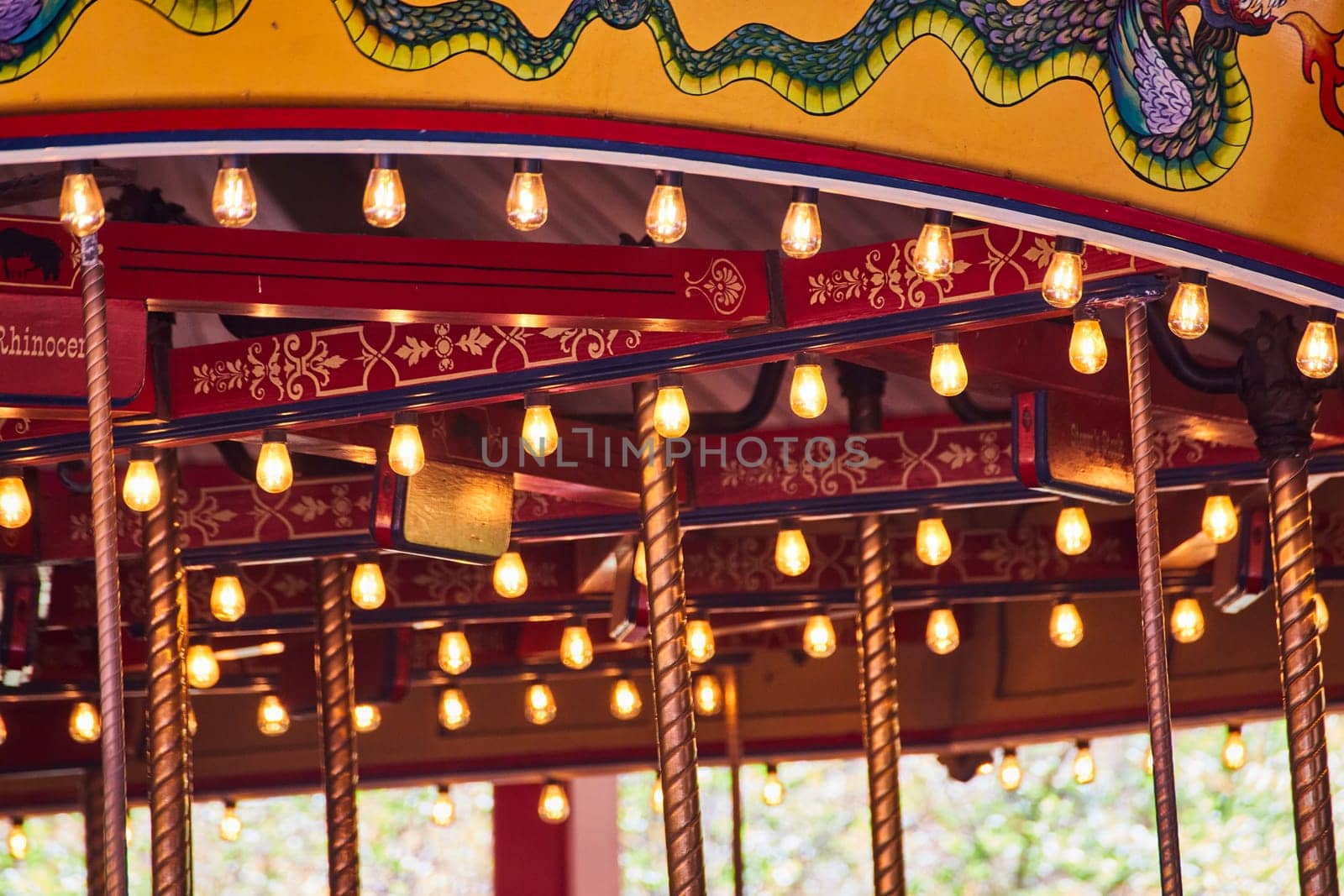 Enchanting carousel at Fort Wayne Children's Zoo, Indiana, showcasing ornate lights and mythical decor.