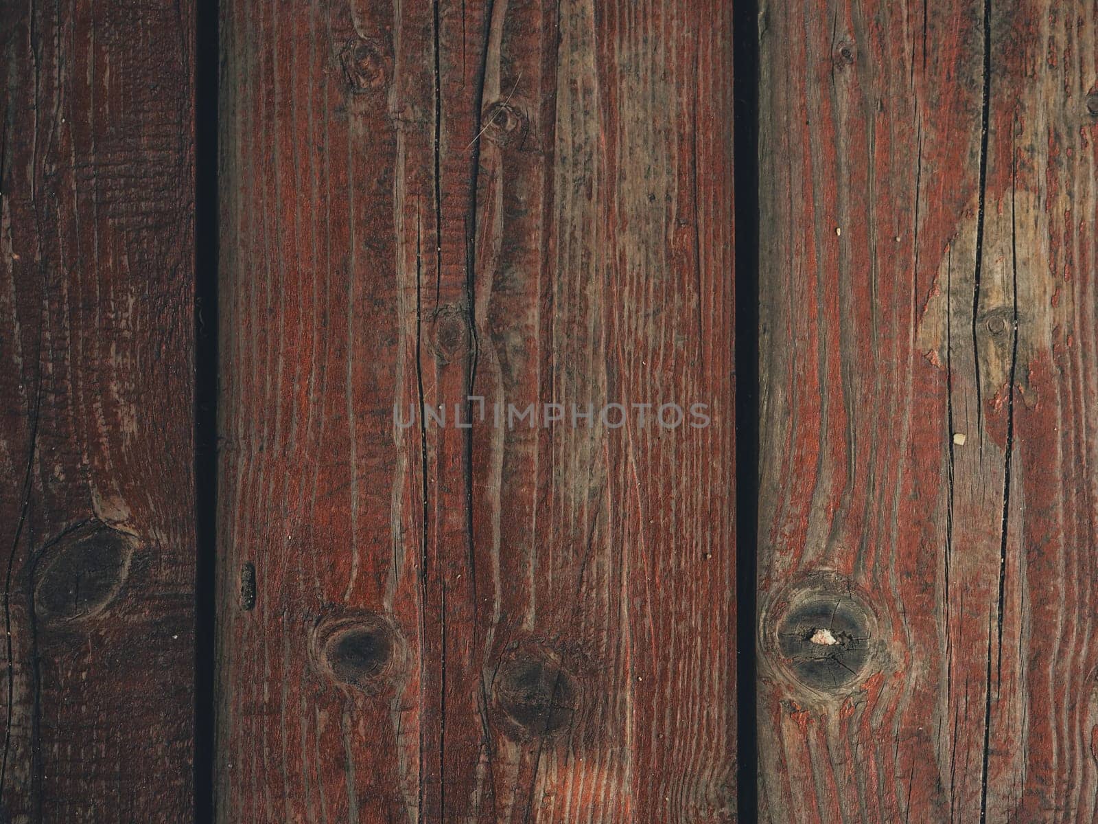 texture of wooden boards with cracked exfoliating old paint