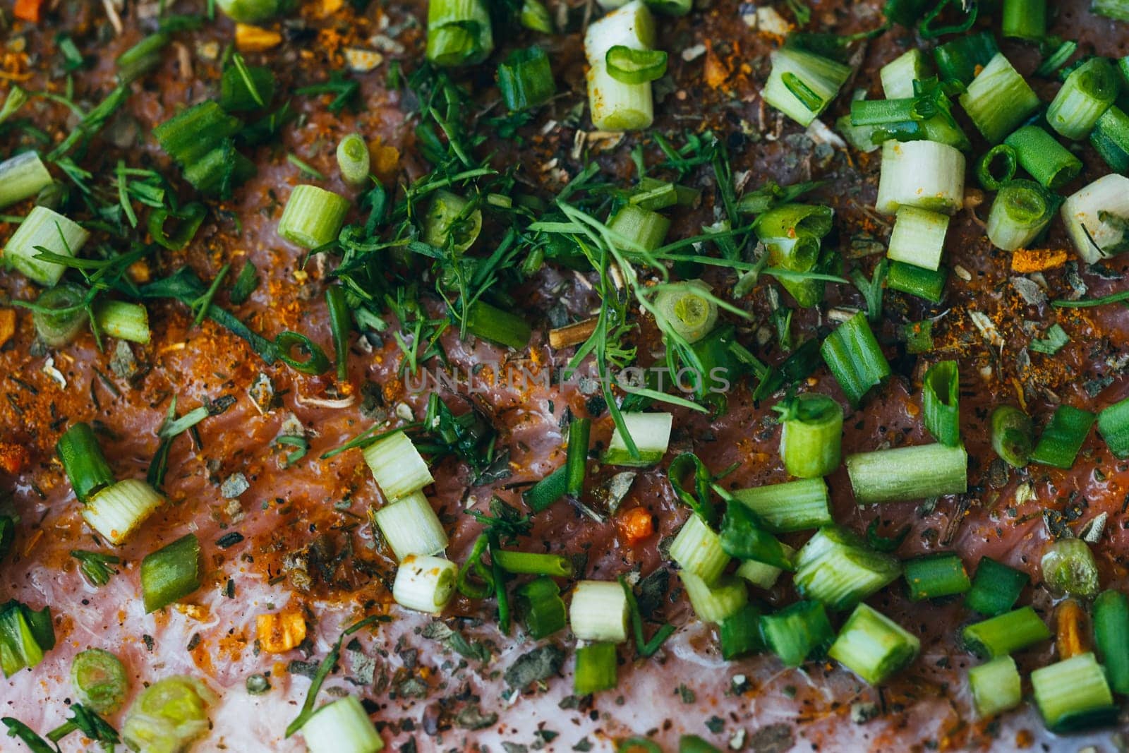 pink salmon meat with spices and herbs close-up