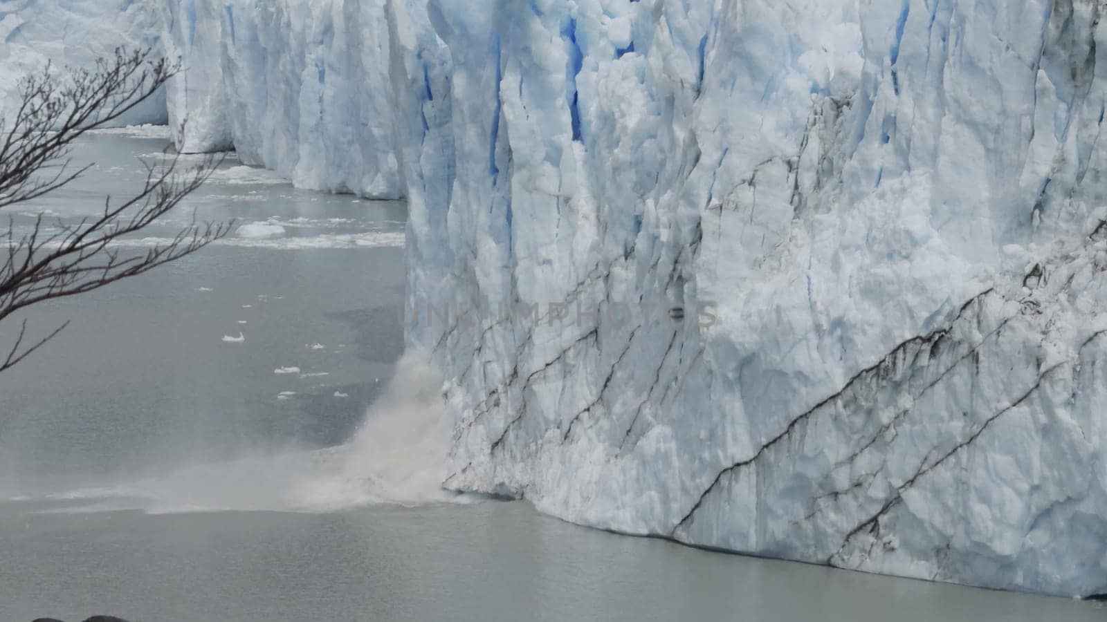 Video shows glacier ice chunks falling into the sea.