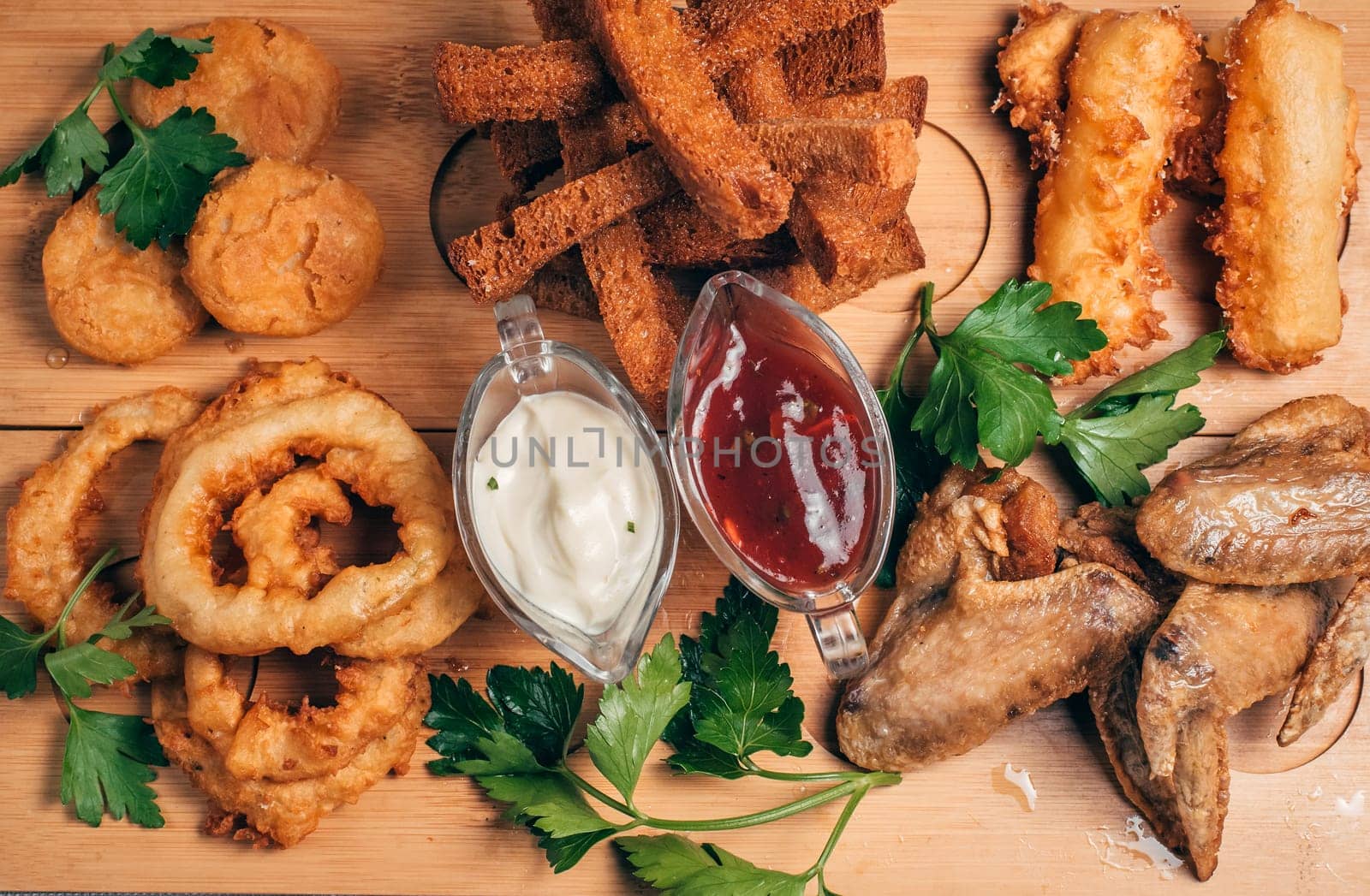 breaded appetizers and crackers on a wooden beer Board