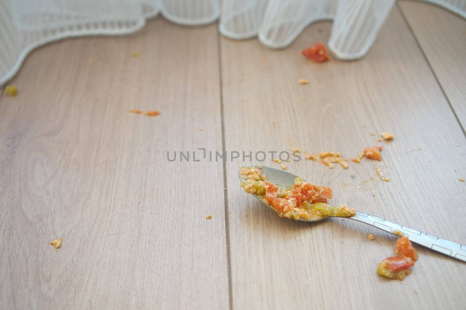 leftover snack with spoon on wooden floor by towfiq007