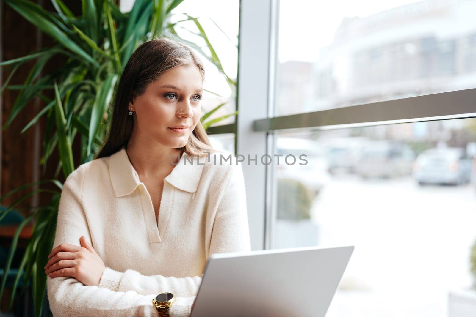 Woman Sitting in Front of Laptop Computer by Fabrikasimf