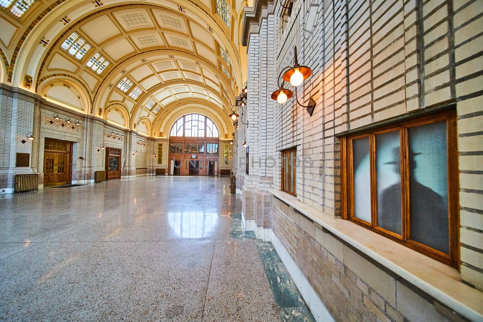 Elegant early 20th-century interior of Baker Street Station in Fort Wayne, Indiana, showcasing grand archways and a regal design.