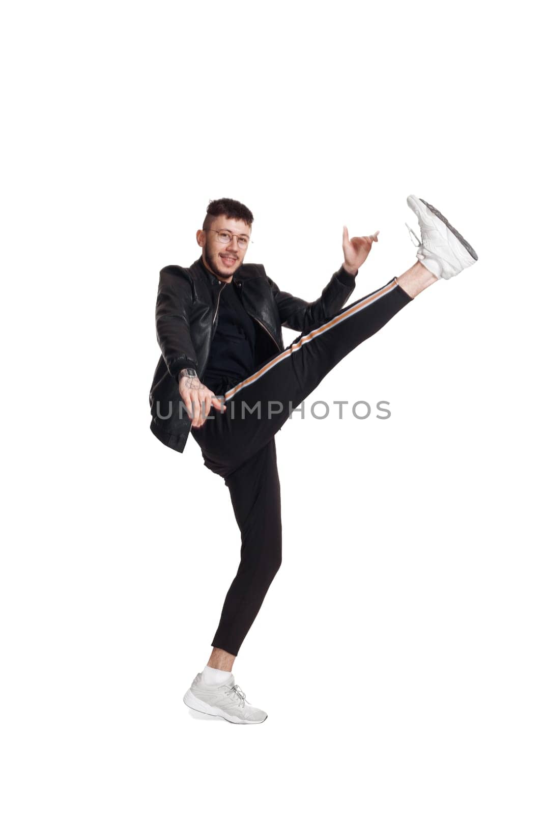 Full-length photo of a funny guy dancing in studio isolated on white background. by nazarovsergey