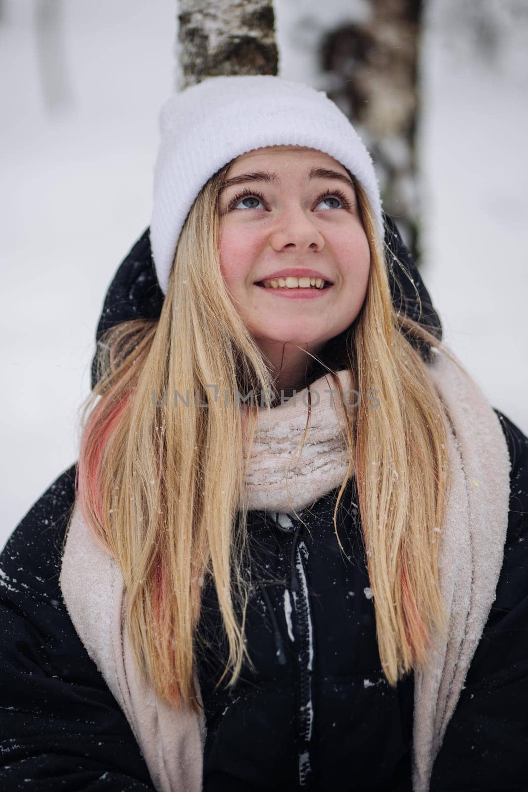 Portrait of a teenage girl in winter in the woods. by DovidPro