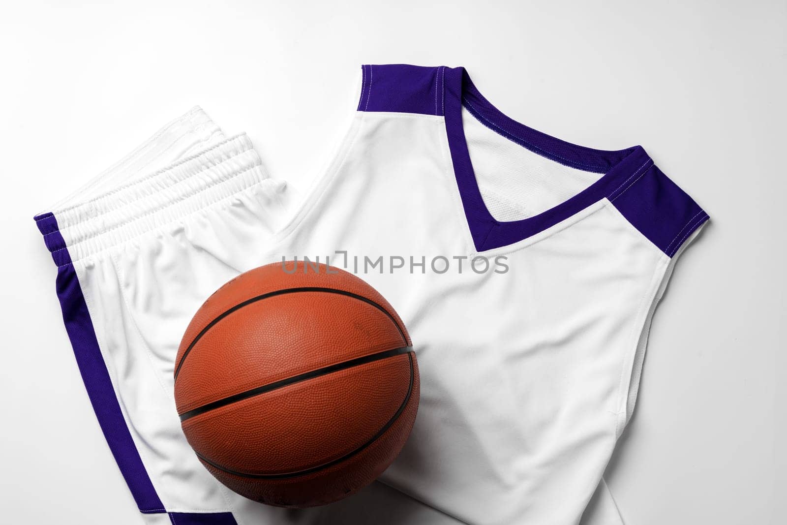 Basketball uniform on white background top view by Fabrikasimf