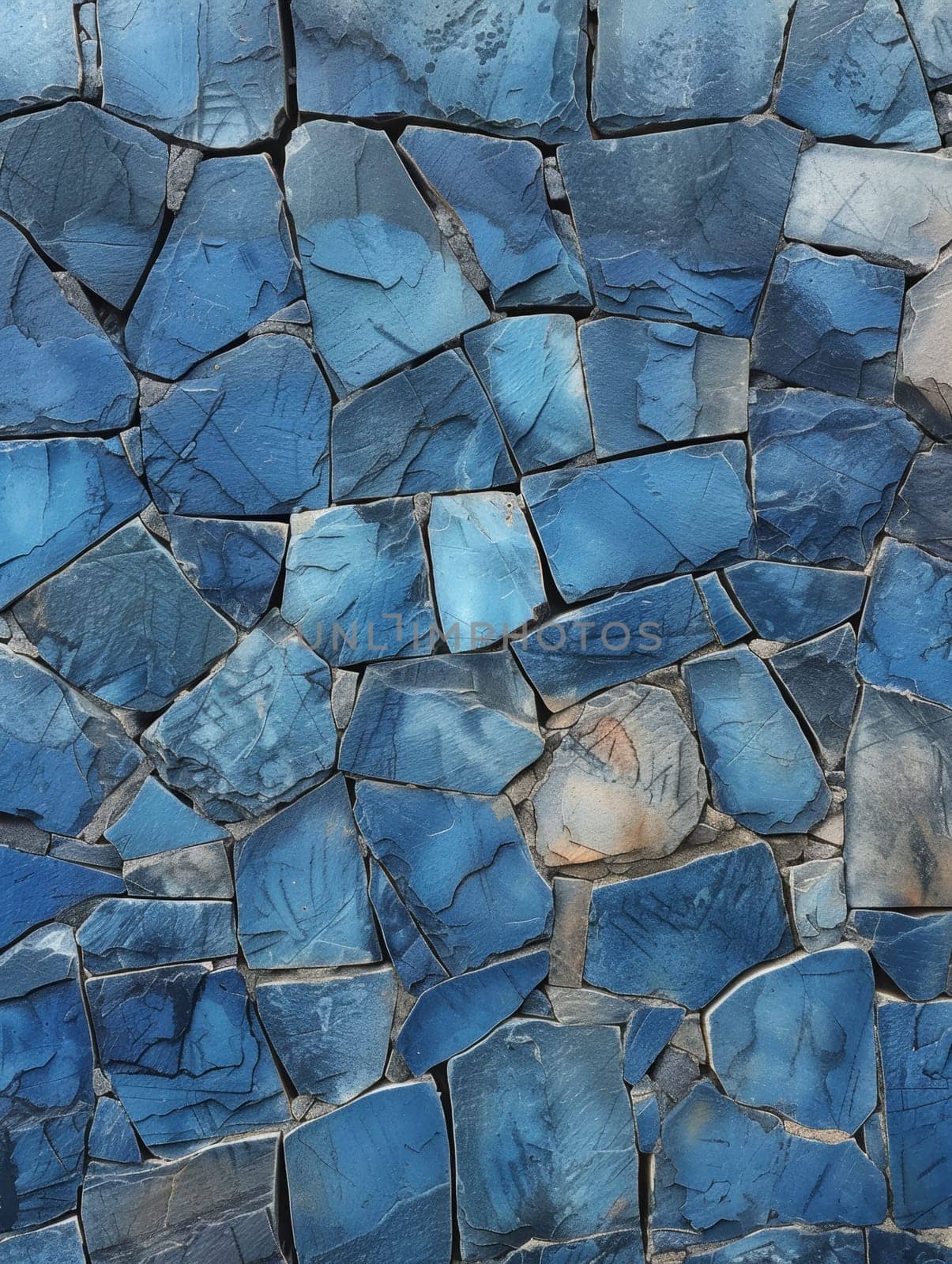 Close-up view of a surface covered with various shapes and sizes of stones embedded in it