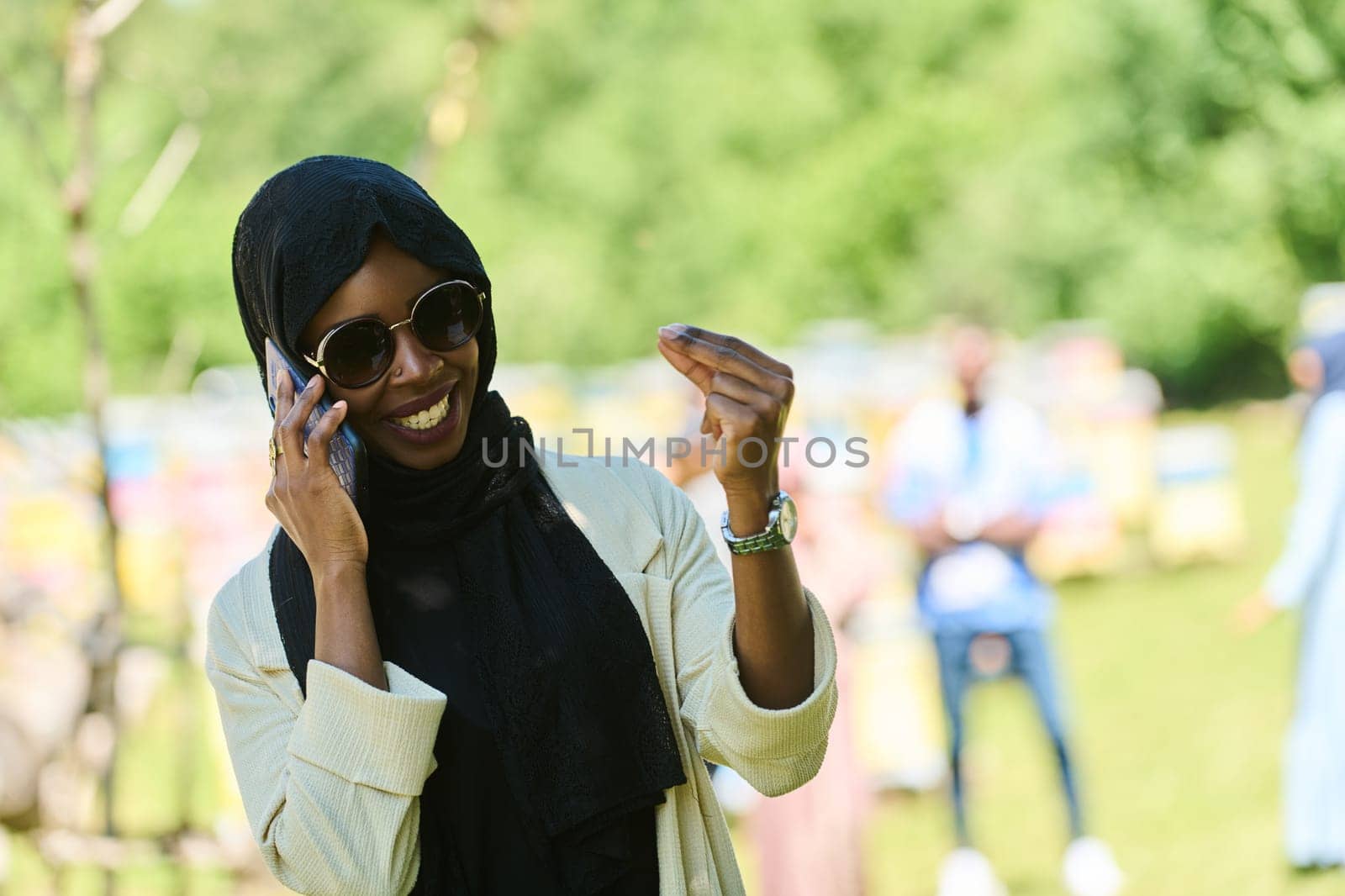 Middle Eastern Muslim woman in a hijab uses a smartphone while managing a small beekeeping business, blending modern technology with traditional practices