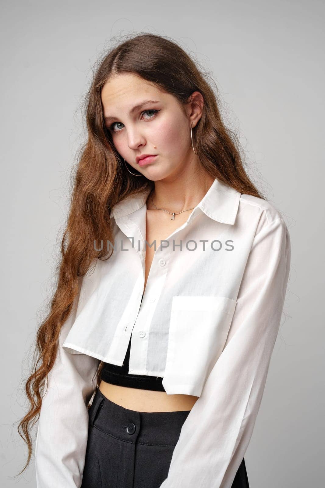 Woman With Long Hair in White Shirt and Black Pants