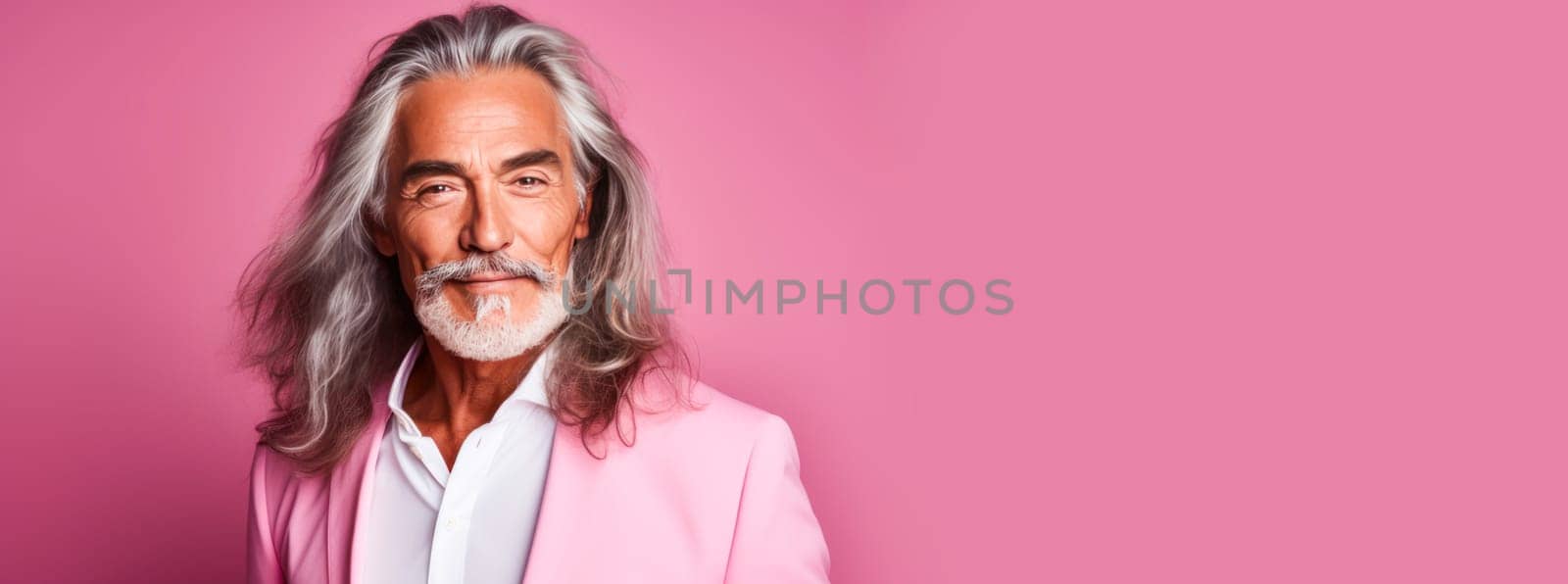 Handsome elderly Latino with long gray hair, on a pink background, banner. by Alla_Yurtayeva