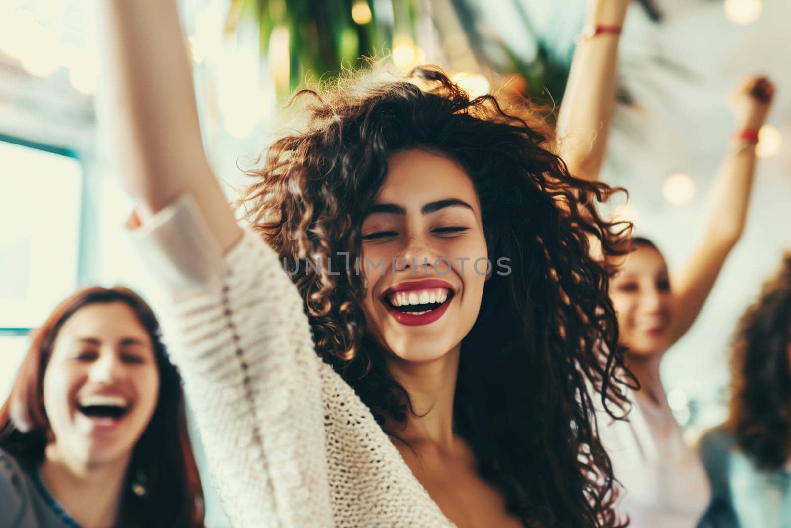 Portrait of joyful cheerful happy laughing woman having fun celebrating with her friends having a party