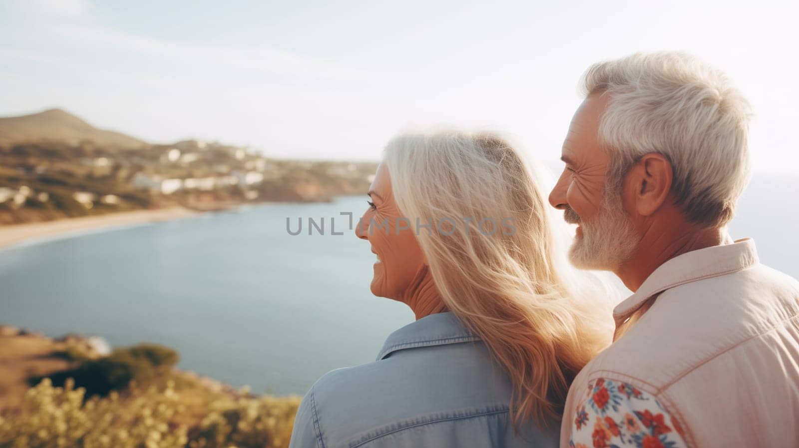 Summer portrait happy smiling senior couple together on sunny coast, enjoying beach vacation at sea by Rohappy