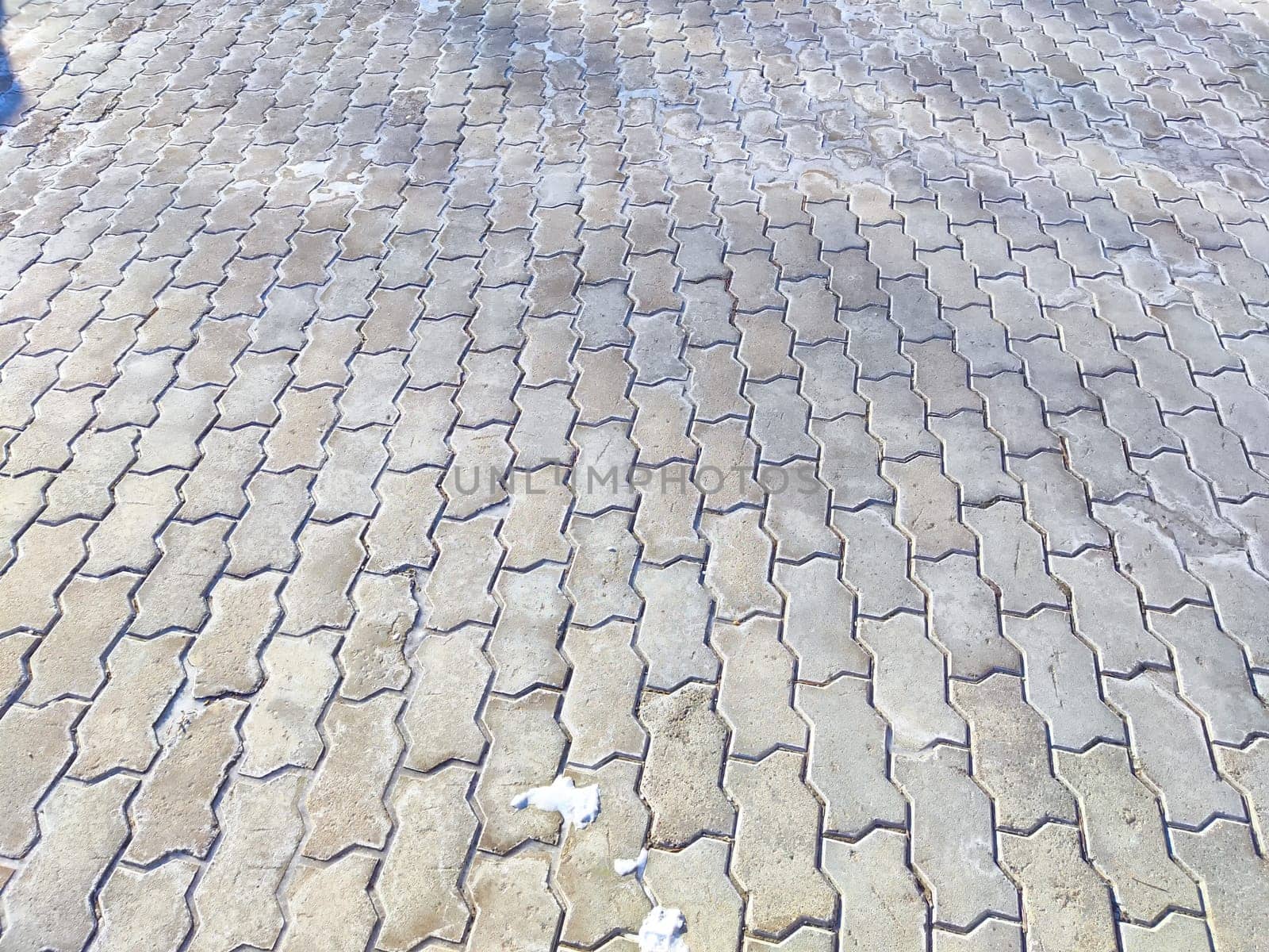 Worn tiles and snow on the ground. Background, texture, pattern, copy space