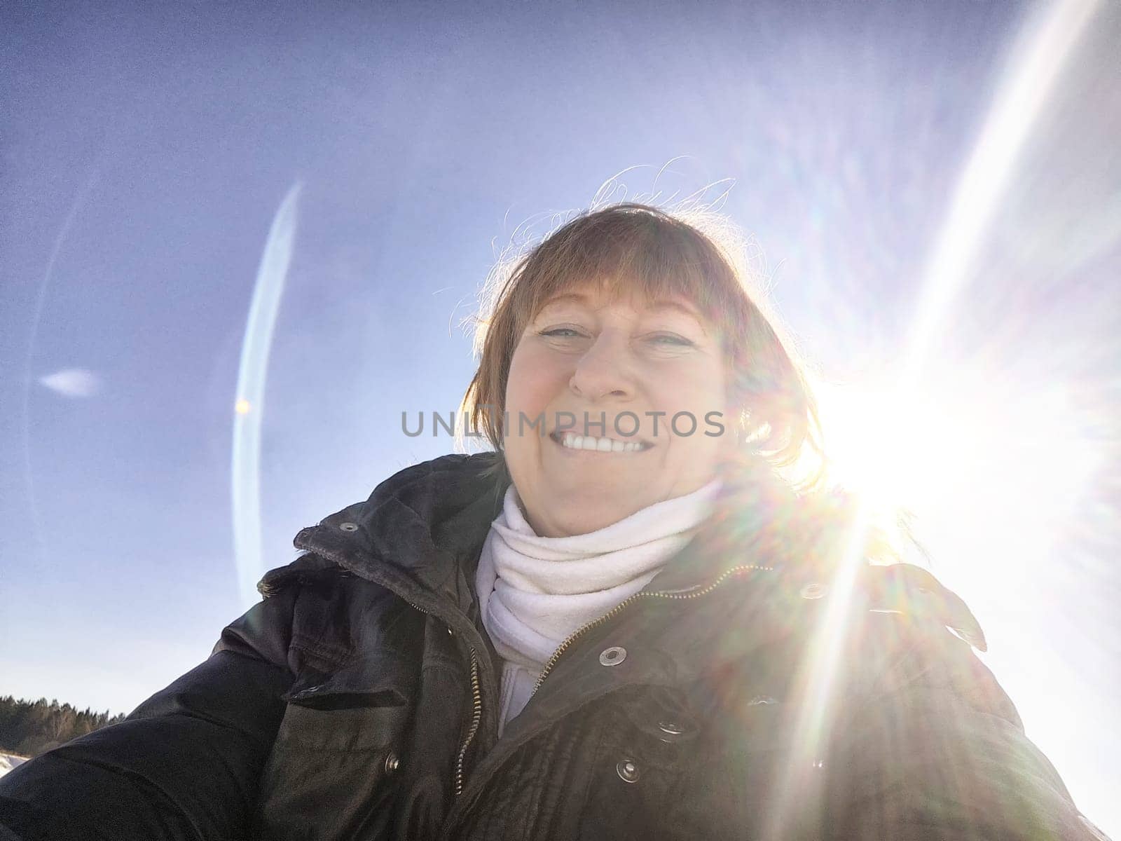Smiling Woman on a Sunny Spring, Winter or early autumn Day Outdoors on nature by keleny