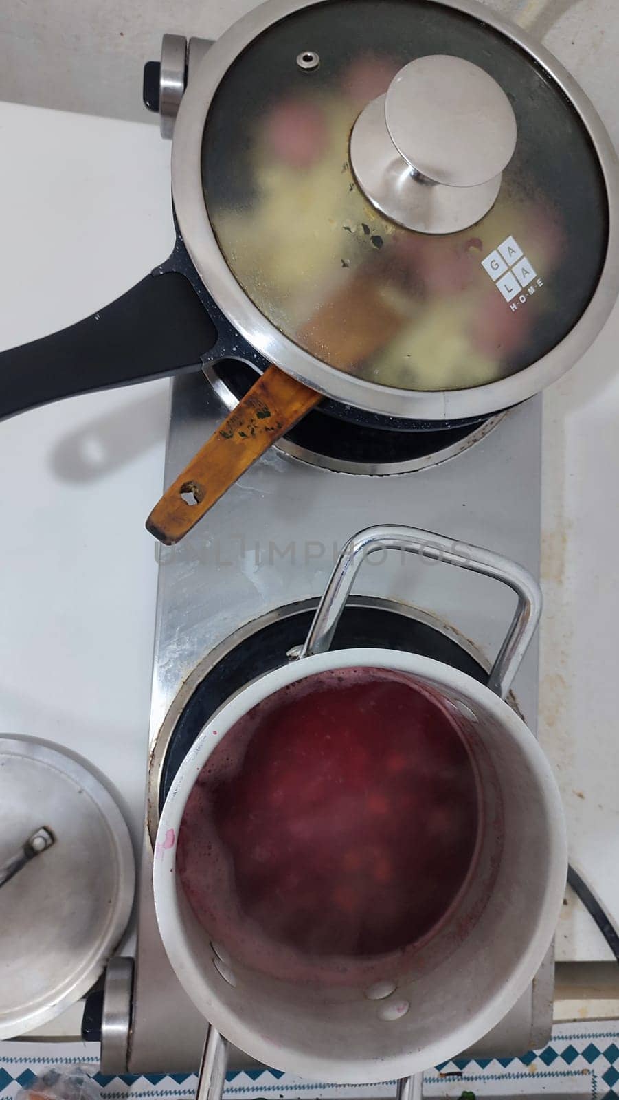 two pans with food on the stove, kitchen. High quality photo