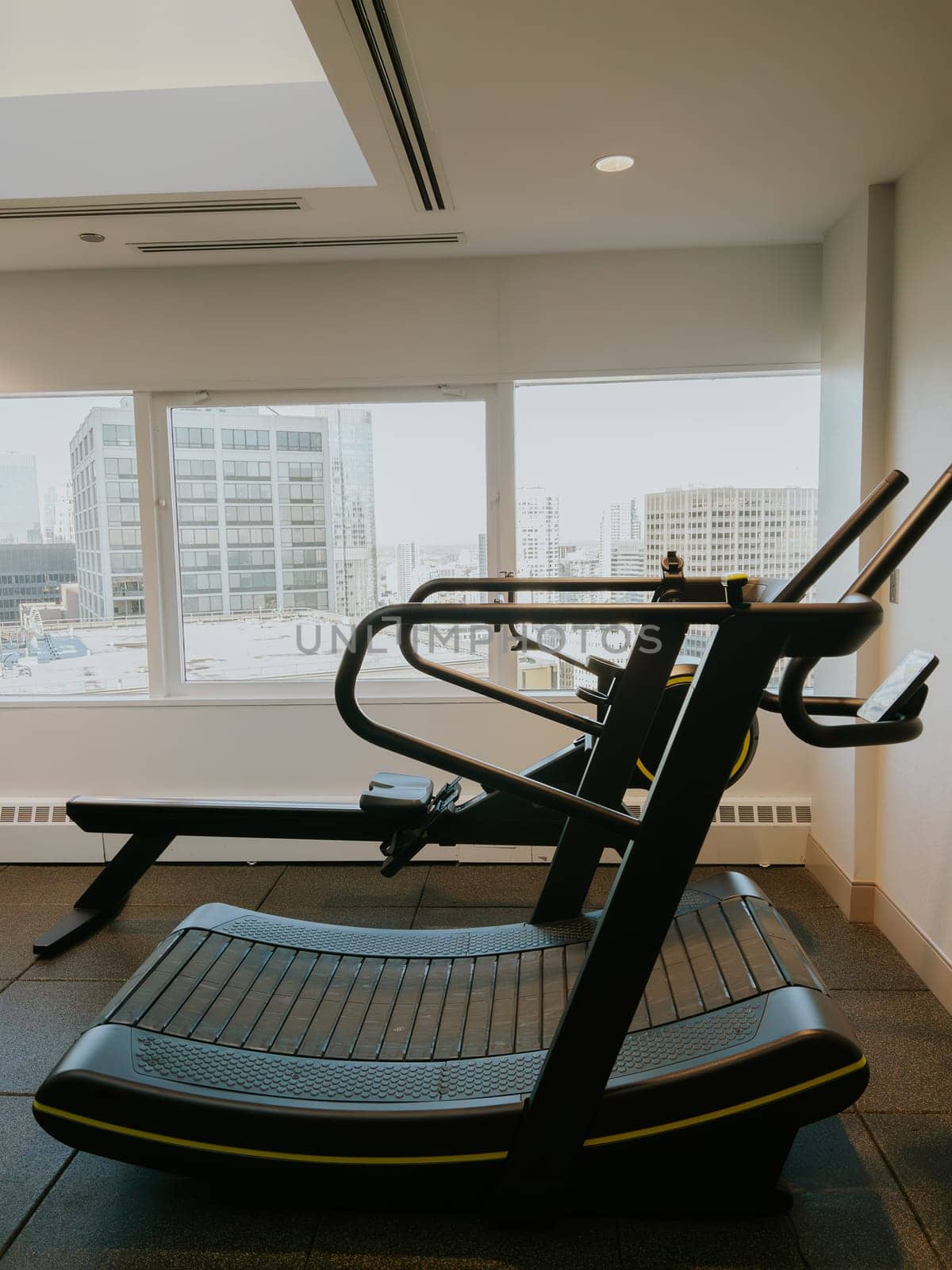 Athletic Girl Running on Treadmill in the Gym by arinahabich