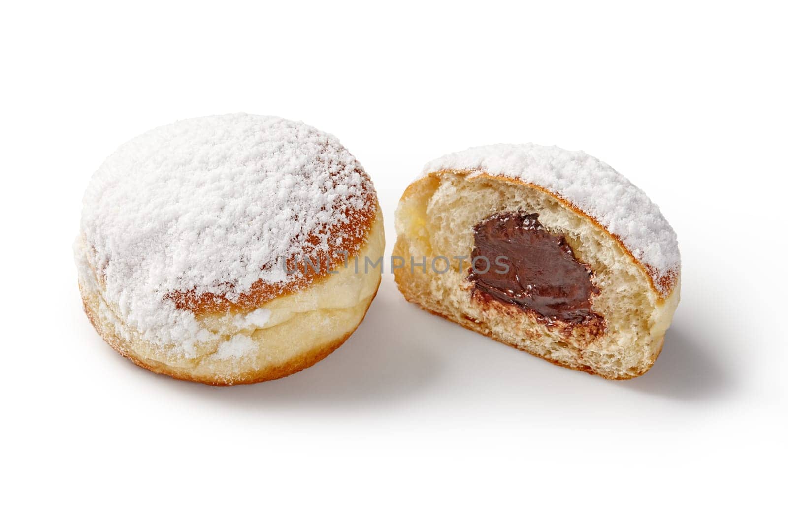 Appetizing soft airy doughnuts with sweet chocolate filling, sprinkled with white powdered sugar. Popular confectionery