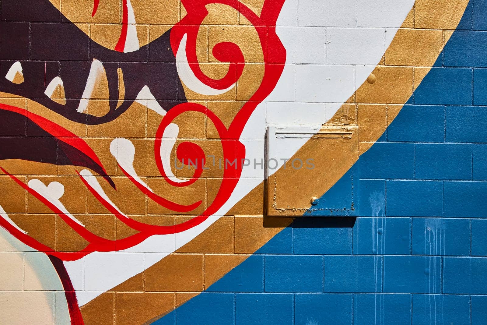 Colorful urban mural in downtown Fort Wayne, Indiana, showcasing vibrant abstract art on a brick wall.