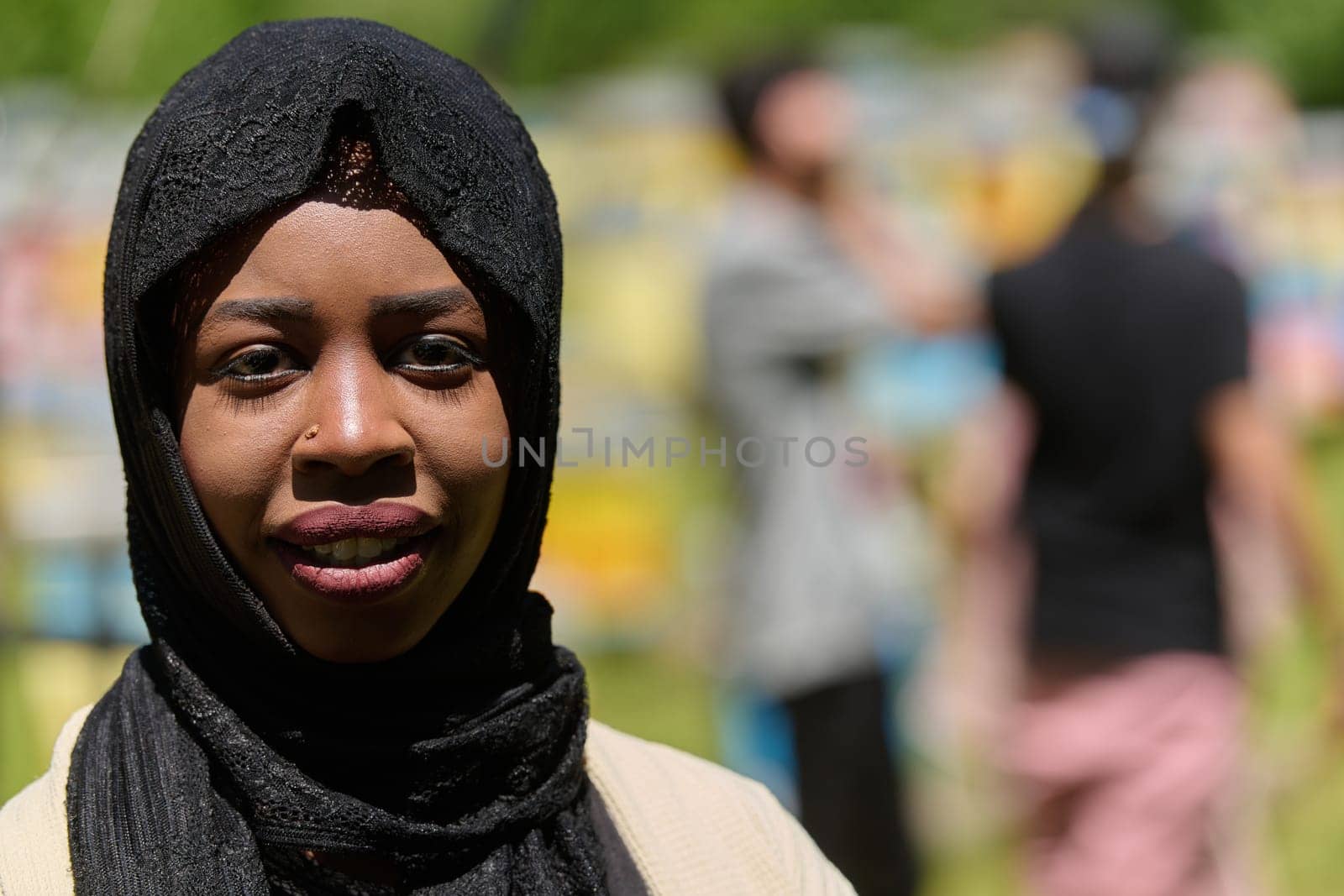 A Middle Eastern Muslim woman in a hijab beams with a radiant smile in a picturesque natural apiary, exuding joy and harmony