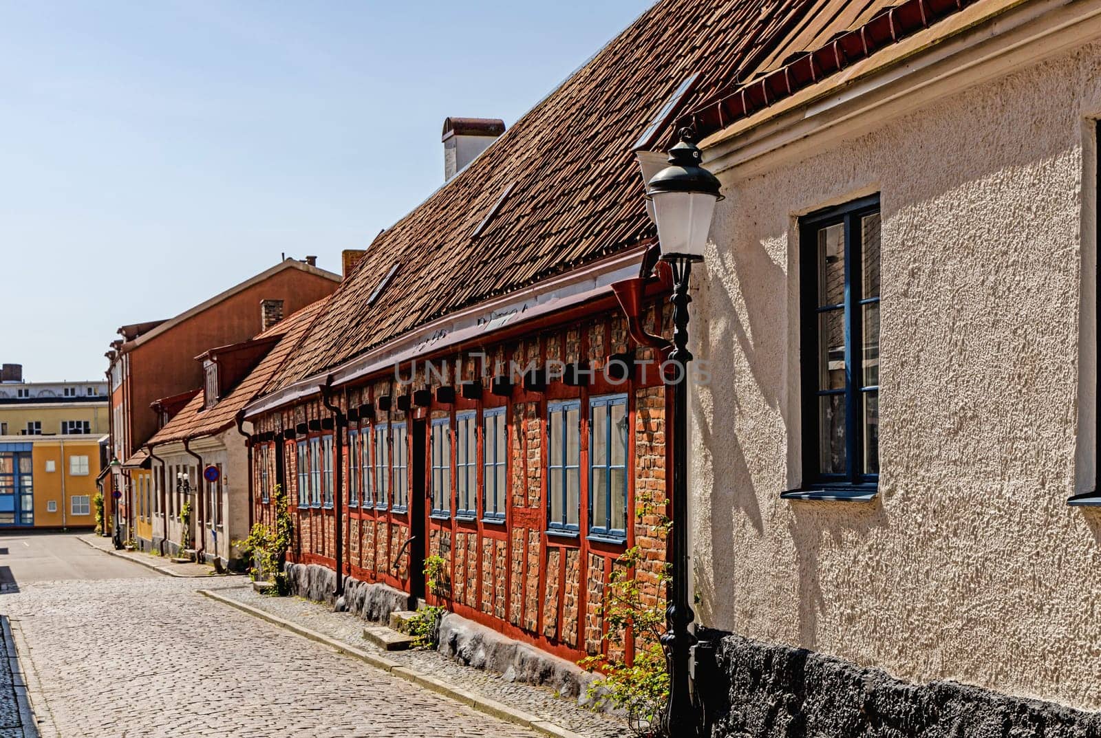 Narrow streets of the old town with colorful houses Ystad, Sweden.