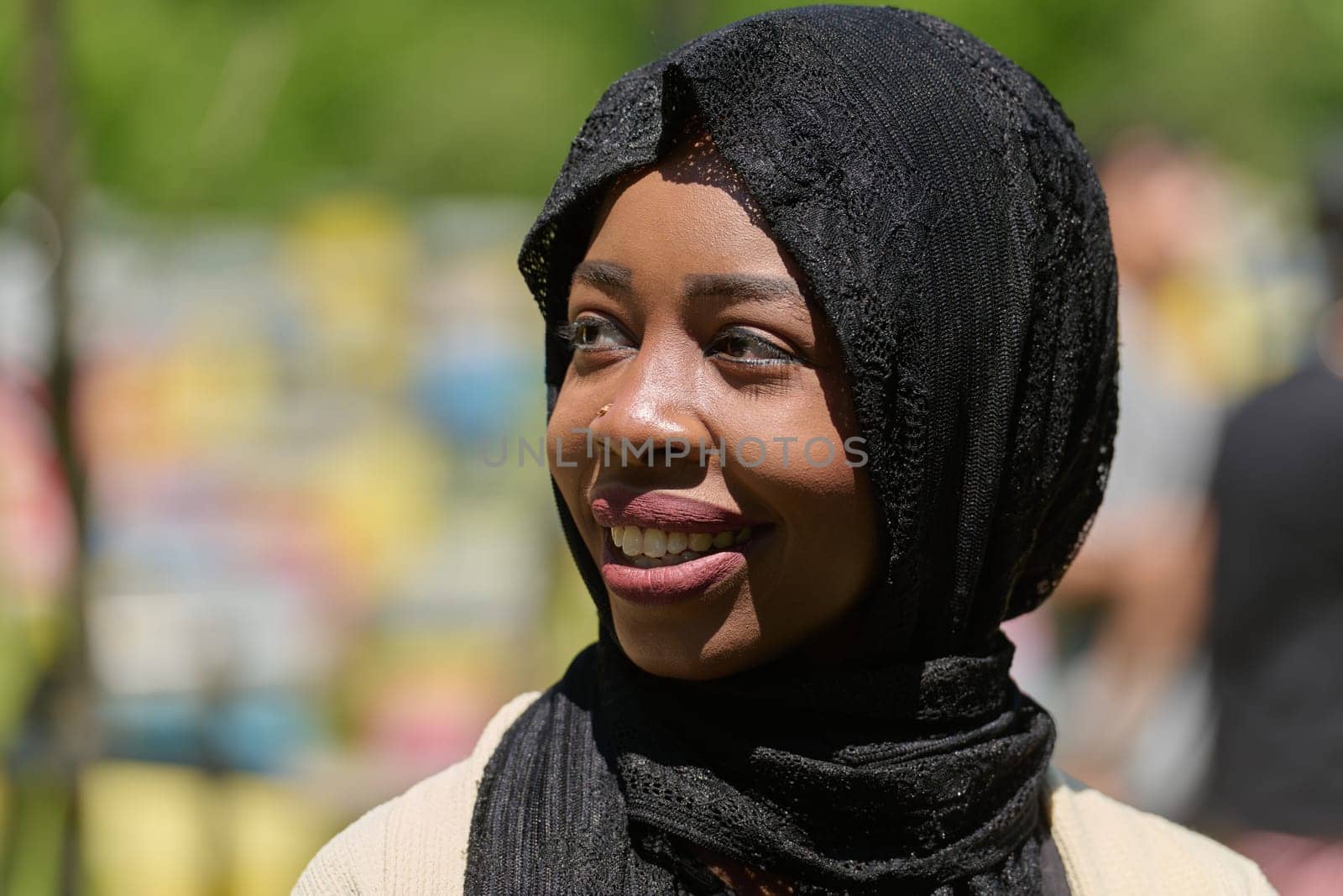 A Middle Eastern Muslim woman in a hijab beams with a radiant smile in a picturesque natural apiary, exuding joy and harmony