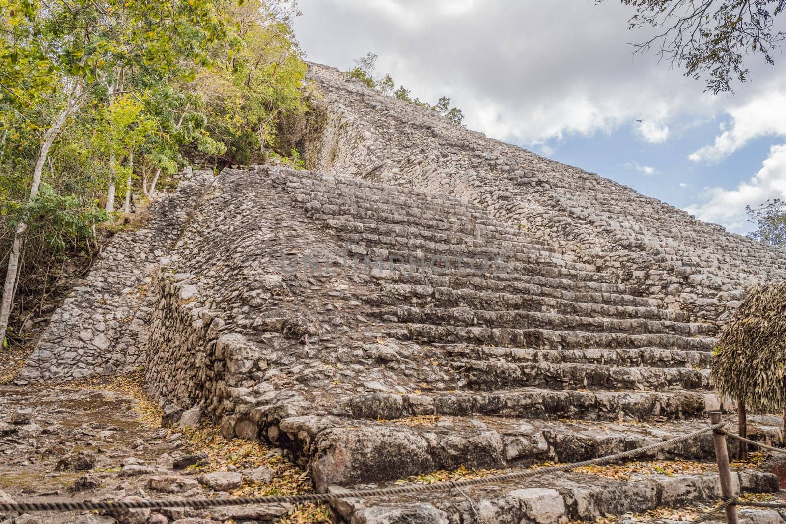Coba, Mexico. Ancient mayan city in Mexico. Coba is an archaeological area and a famous landmark of Yucatan Peninsula. Cloudy sky over a pyramid in Mexico by galitskaya