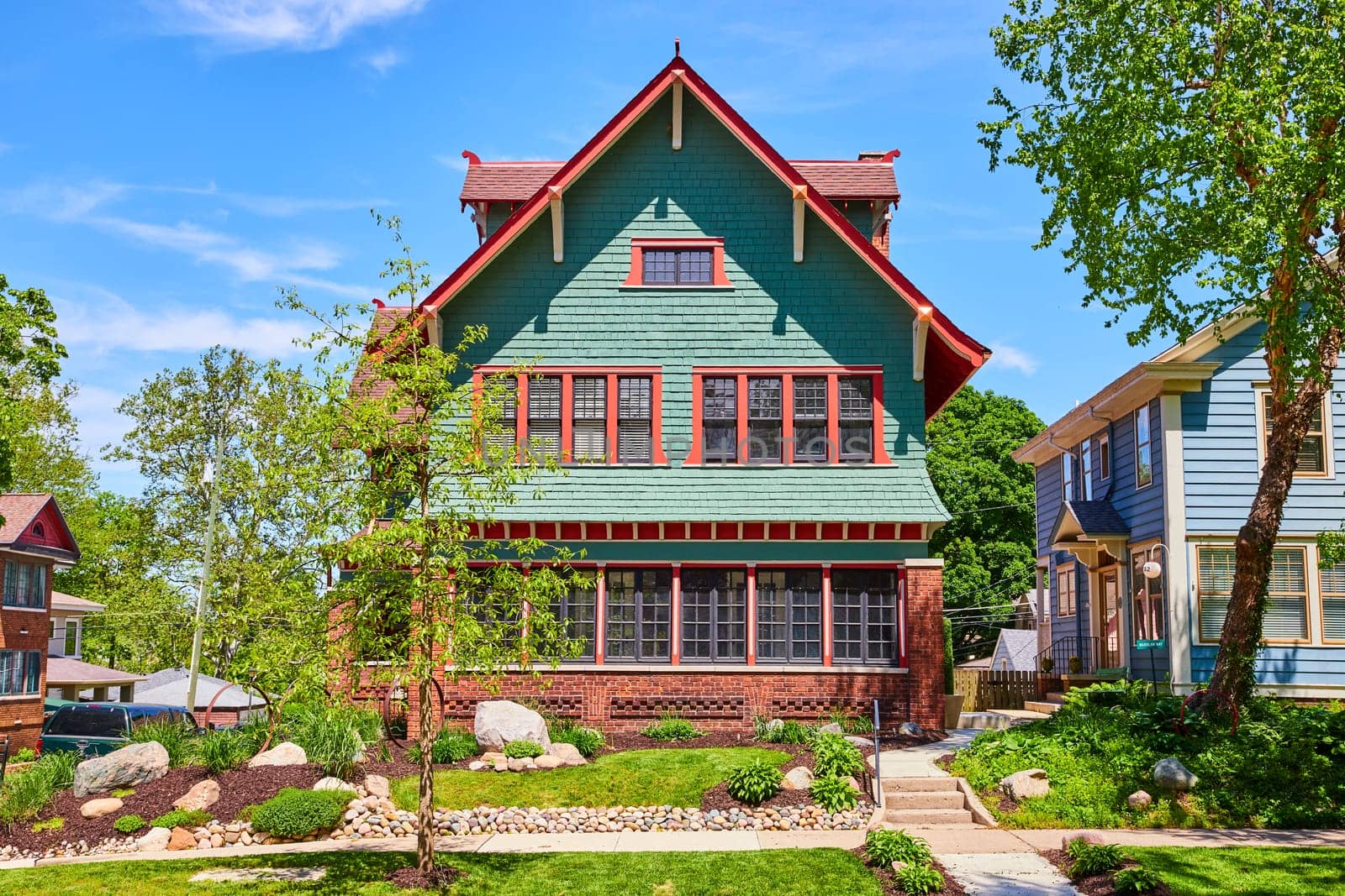 Classic mint green American home in Fort Wayne, Indiana, showcasing suburban tranquility and style.