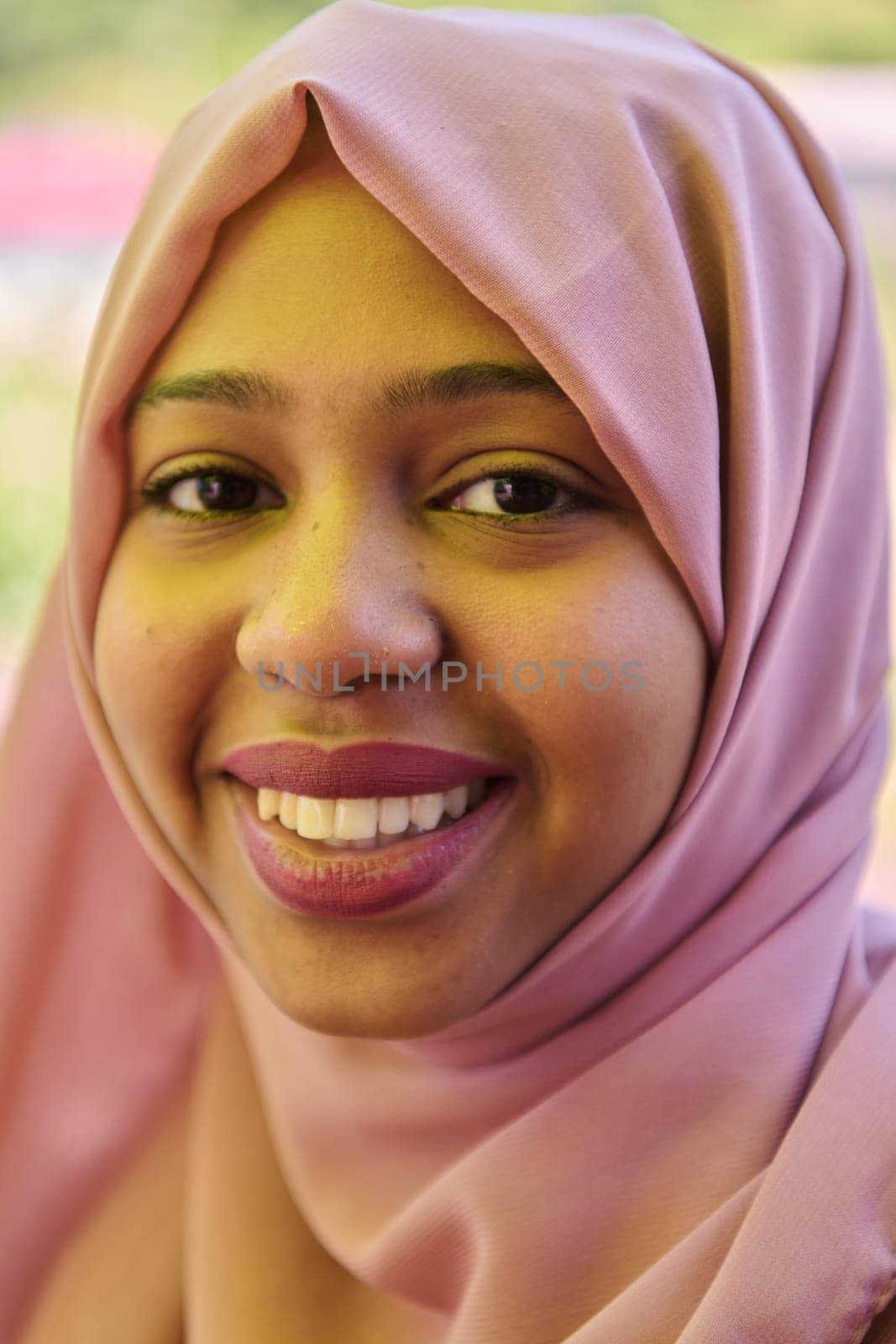 Close up Portrait of a Joyful Middle Eastern Hijabi by dotshock